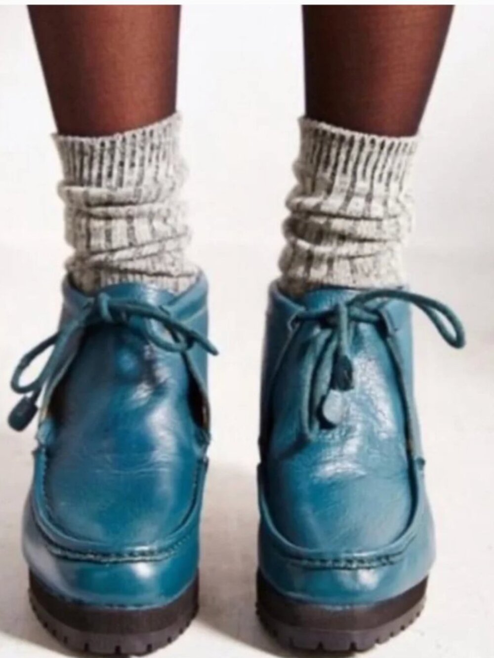 Ectote leather moccasin boots with ties.